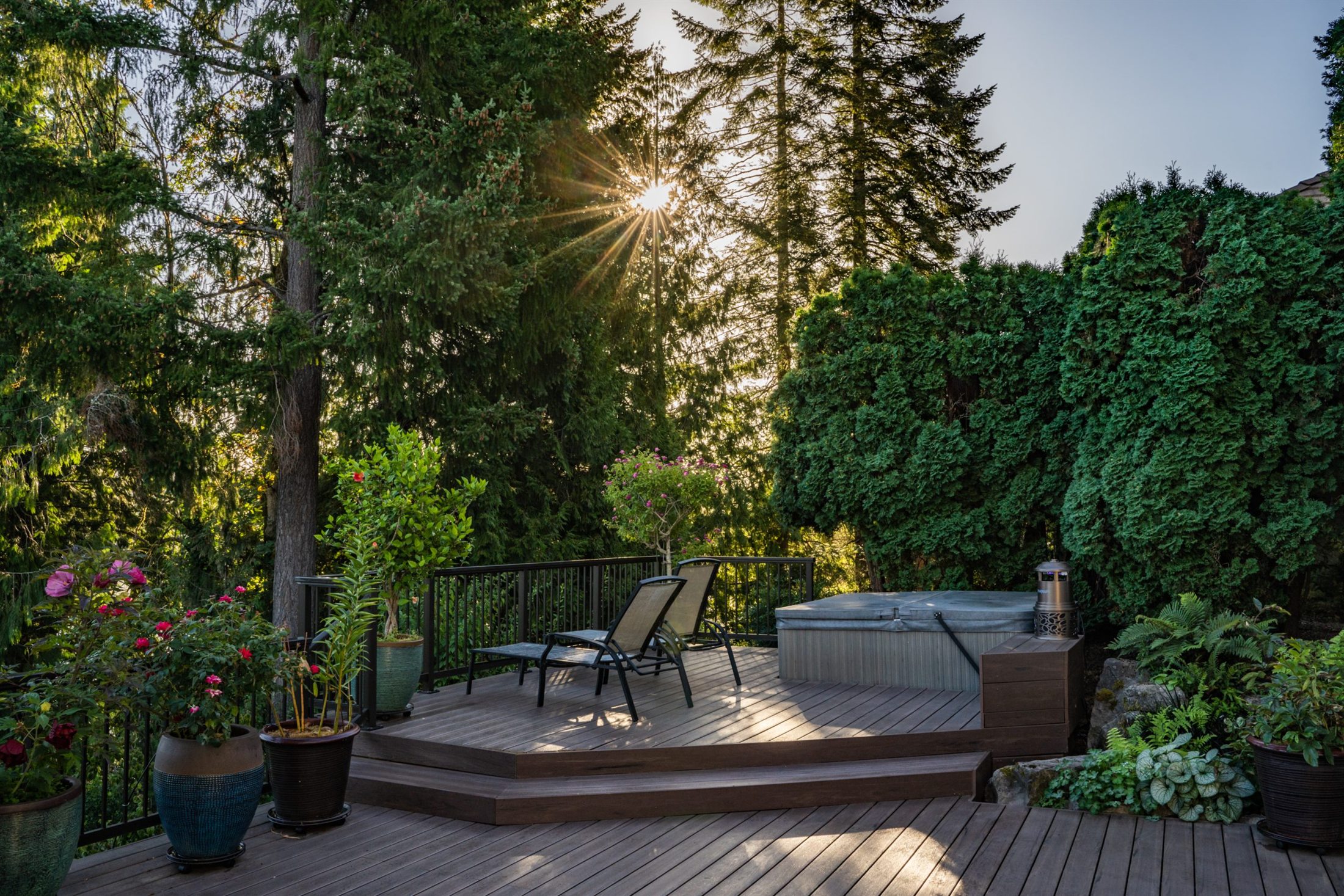 Pacific Northwest home with elevated deck and black railing